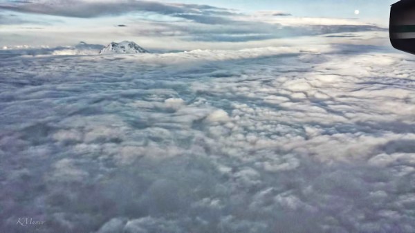 clouds above mountain-moon-jet-KMuncy-SwittersB